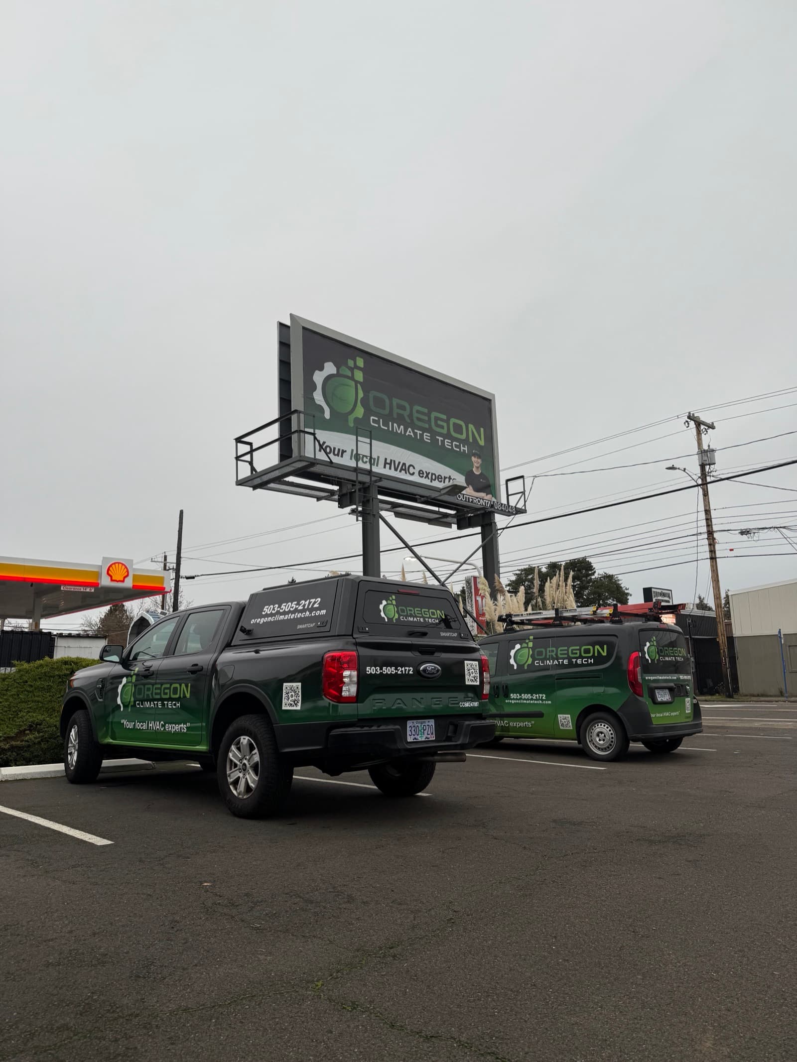 Oregon Climate Tech branded truck and van out on a Portland metro job.