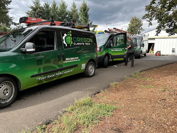 Oregon Climate Tech service fleet, branded vans covering Portland.
