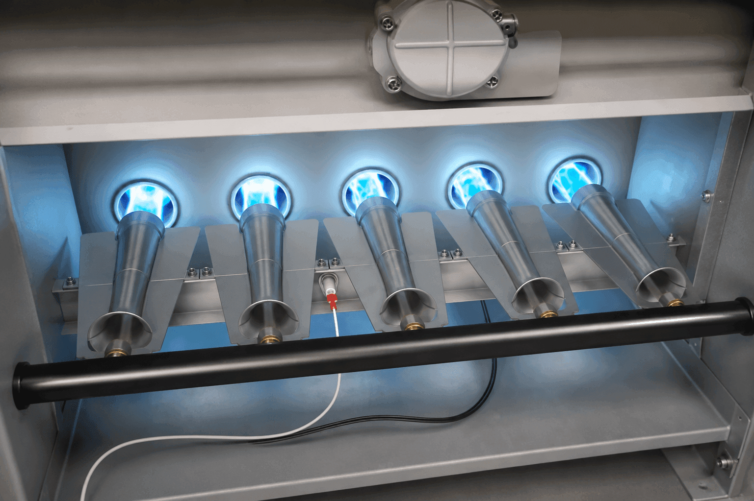 Steady blue flames on a properly tuned furnace burner assembly.