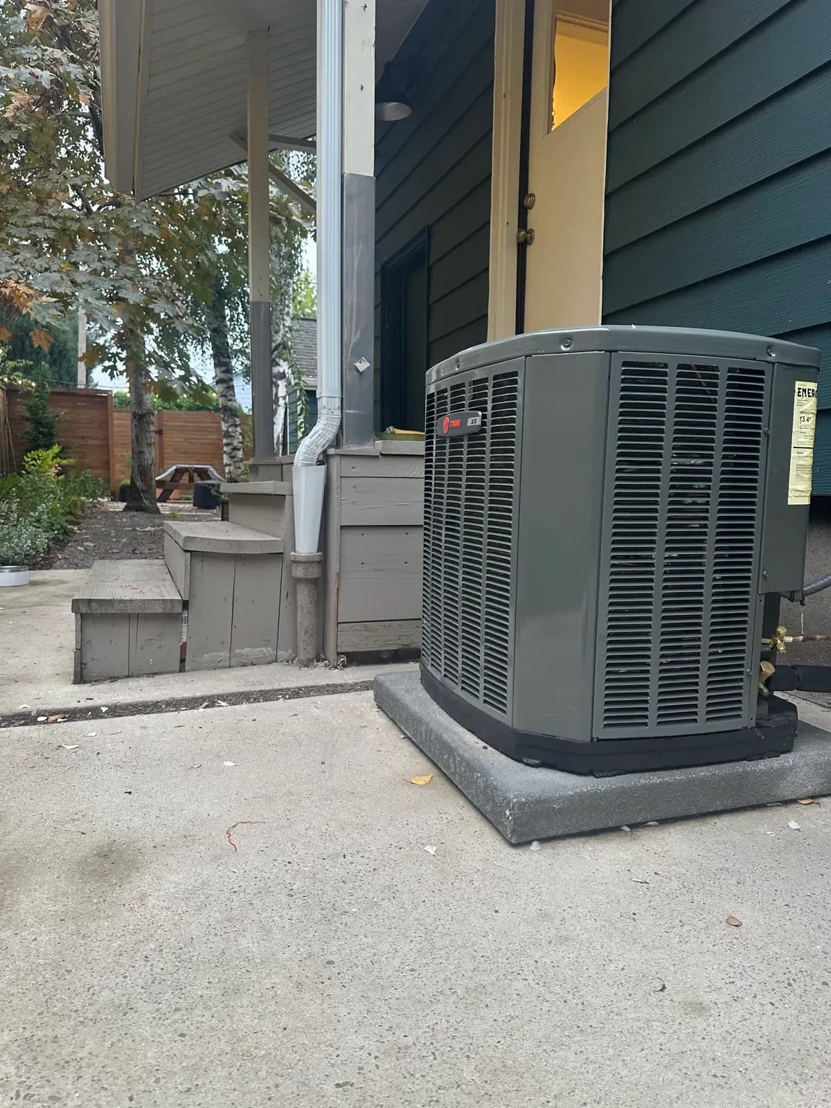 Outdoor heat pump installed beside a Portland-area home.
