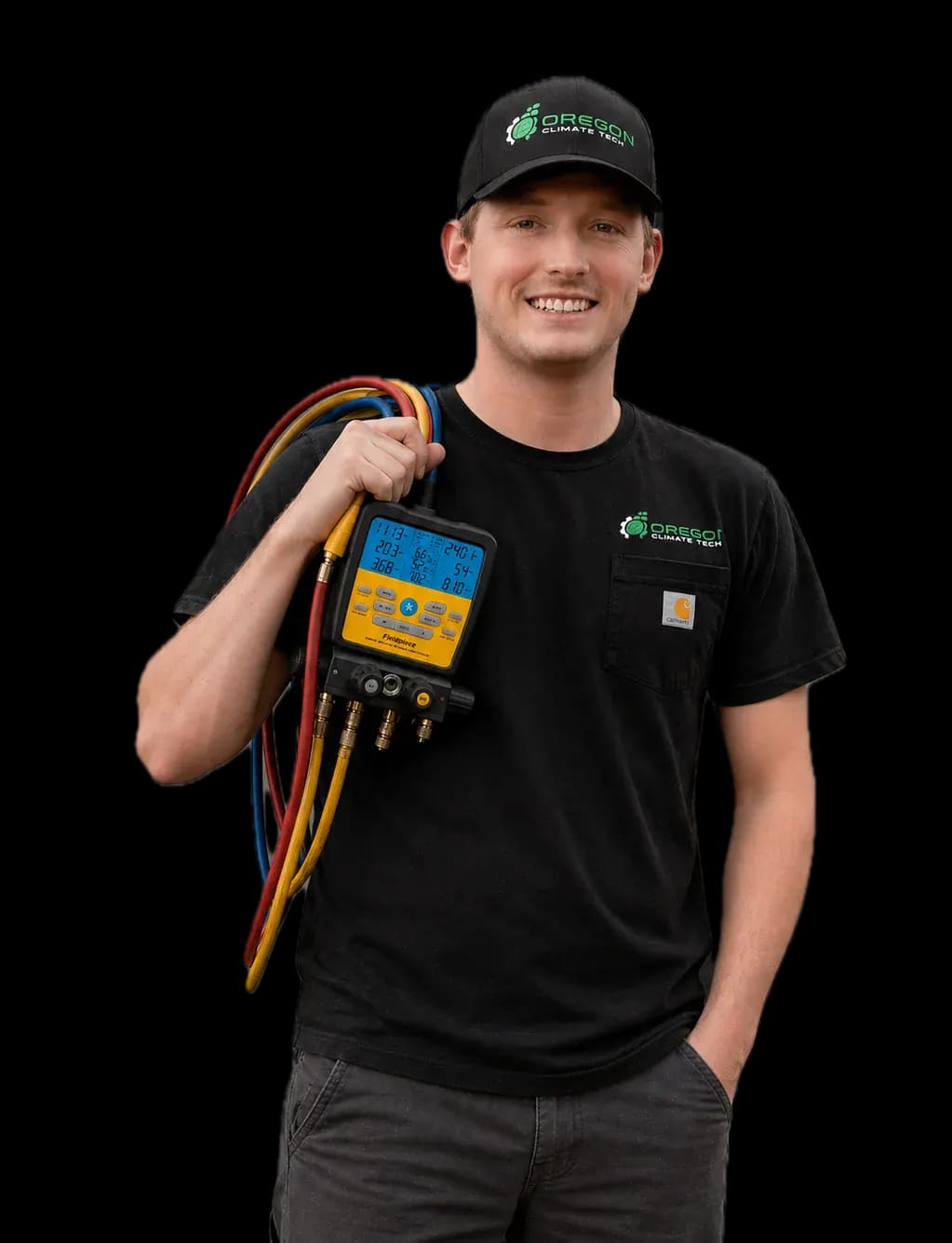 Caleb, an Oregon Climate Tech HVAC installer, holding refrigerant gauges in branded shirt and cap.