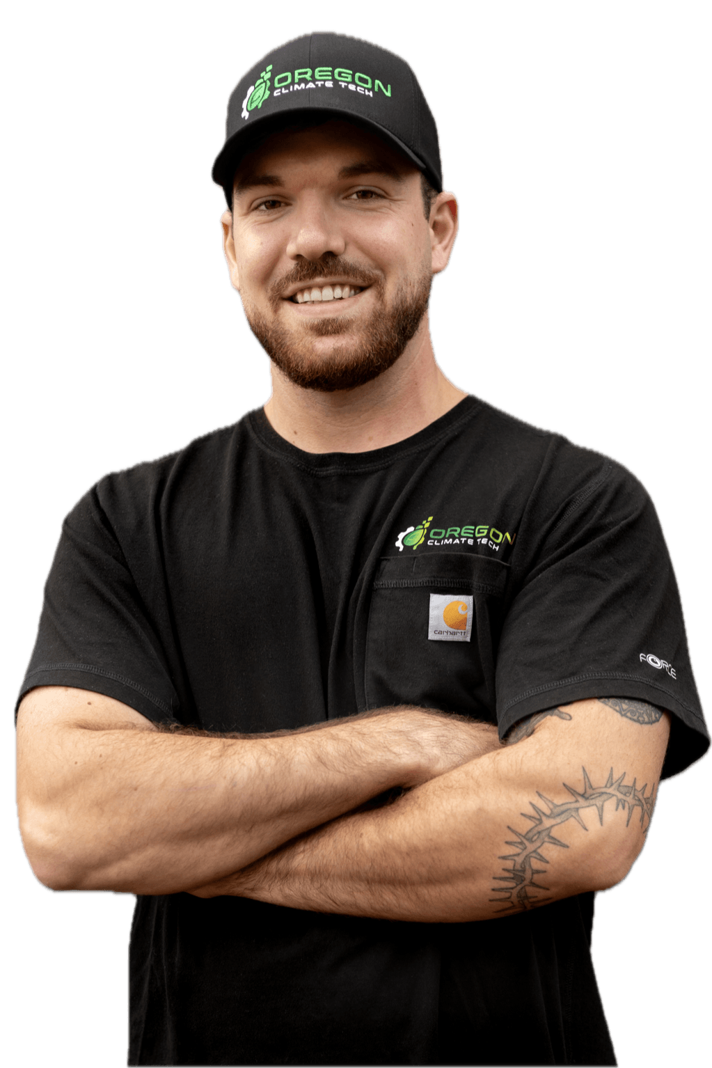 Travis, an Oregon Climate Tech HVAC technician, in branded shirt and cap.