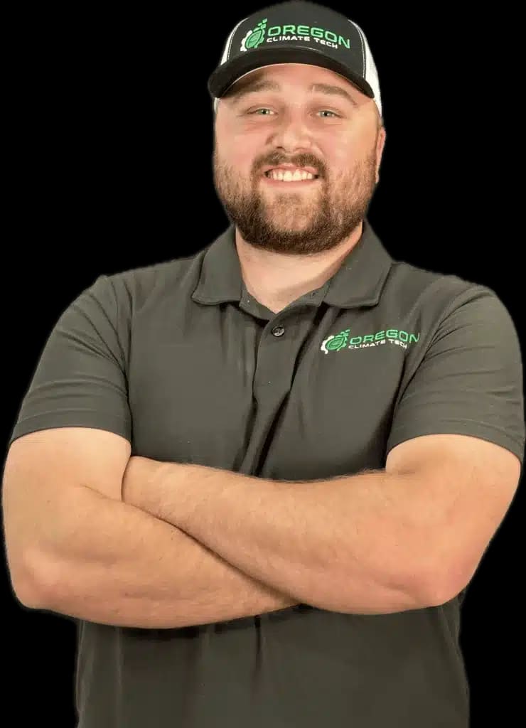 Tristin, an Oregon Climate Tech electrician, in branded uniform.