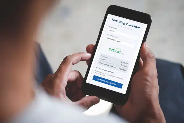 looking at financing website on iphone of hearth.com
